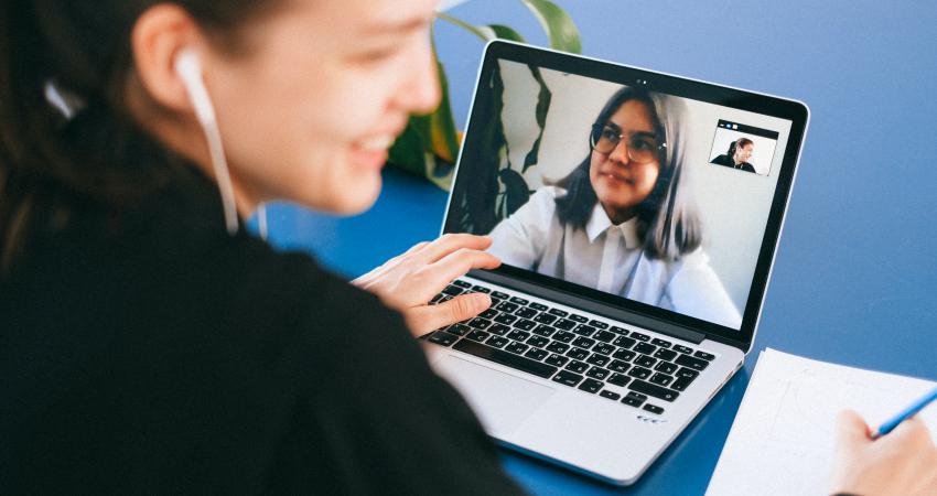 Woman receives online class through video conferencing app